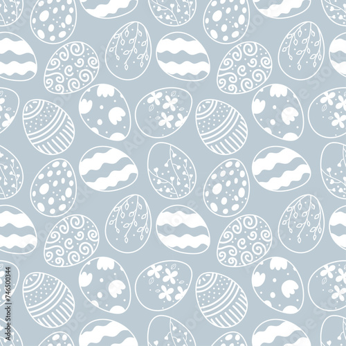 Seamless Easter pattern on blue background with white silhouette of Easter bunnies and eggs in vintage style with floral elements. Unique design template for holiday decorations, printing and web use.