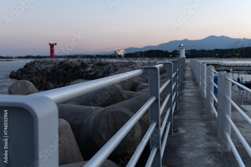 View of the footpath and lighthouse in the evening photo