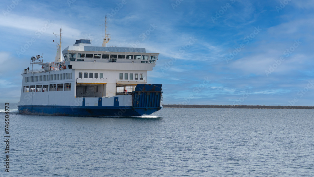 ferry at the entrance to the port, carloforte, south sardinia.