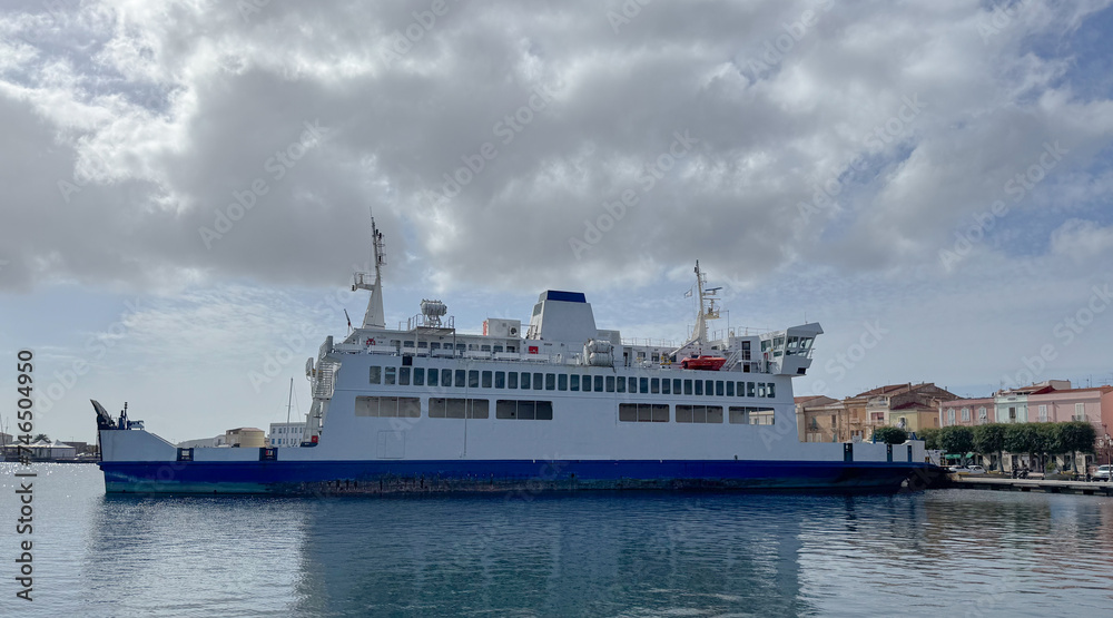 ferry at the entrance to the port, carloforte, south sardinia.