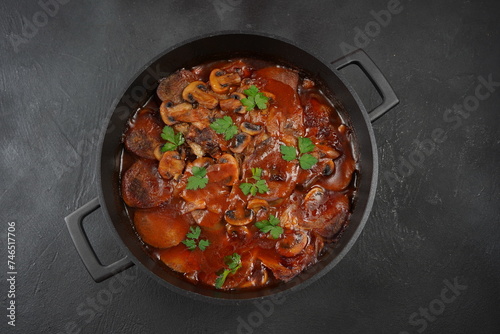 Slowly stewed beef tongue with mushrooms and onions photo