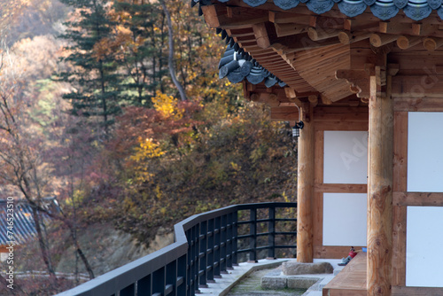 The exterior of Buddhist temple building on the autumn mountain photo