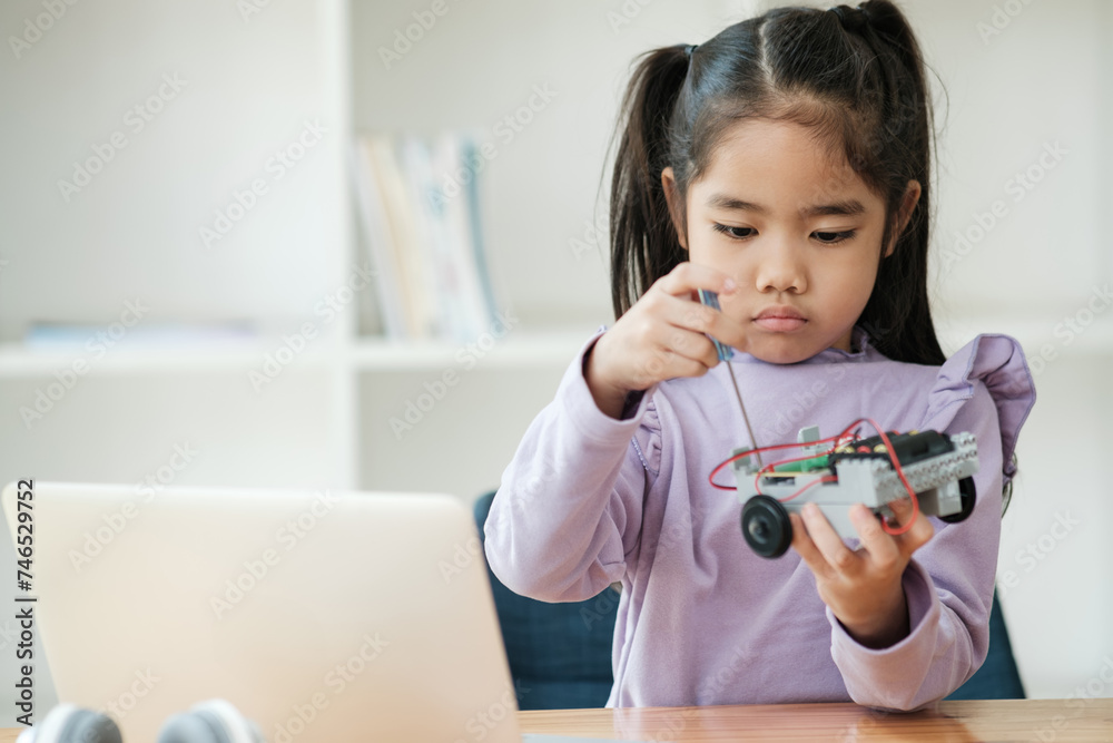 STEM education concept. Asian young girl learning robot design. STEM education concept. Asian young girl learning robot design.