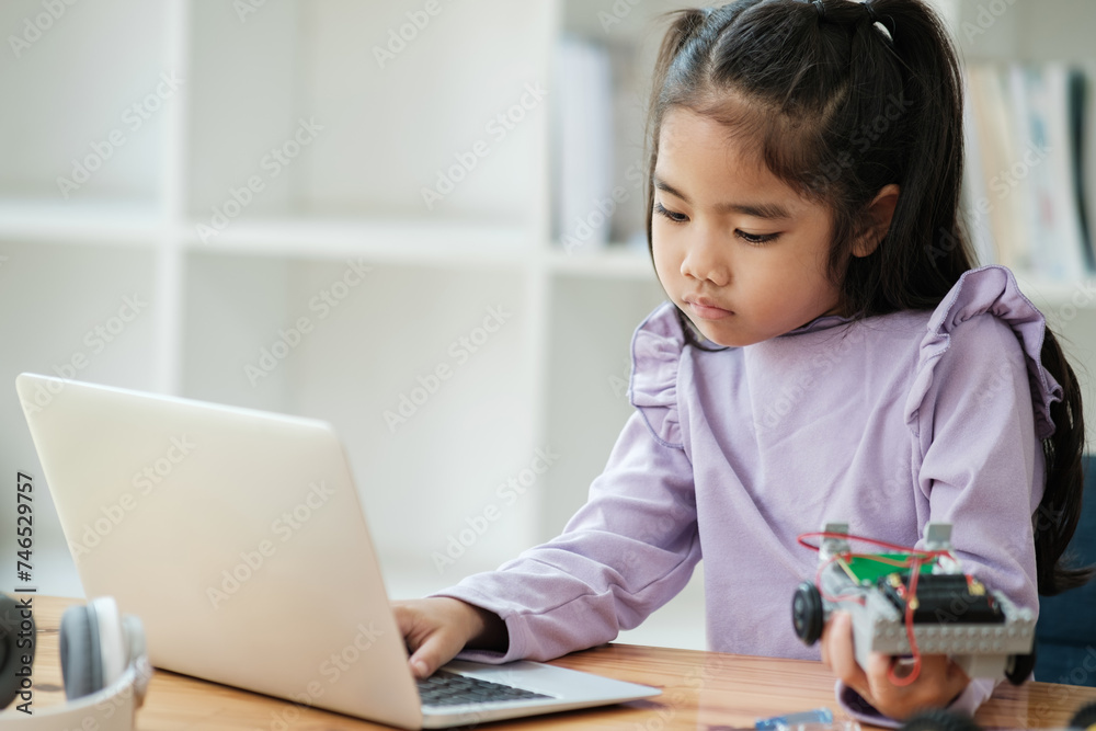 STEM education concept. Asian young girl learning robot design. STEM education concept. Asian young girl learning robot design.
