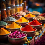 Rows of colorful spices in a market.