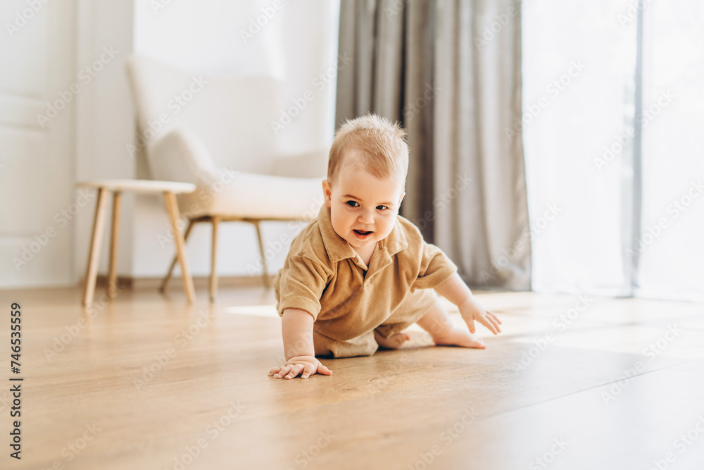 Baby Crawling on the Floor in a Room Baby Crawling on the Floor in a Room