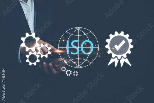 ISO standards quality control, Customer Satisfaction Guarantee concept on virtual screens, Standardization, Businessman using laptop computer with quality assurance and document icon for ISO.