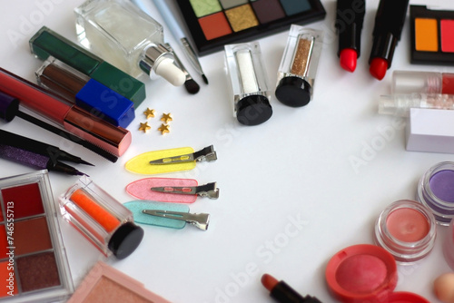 Various colorful beauty products on white background. Selective focus.