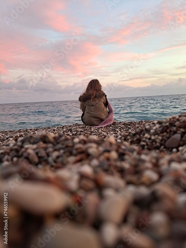 person sitting on the beach