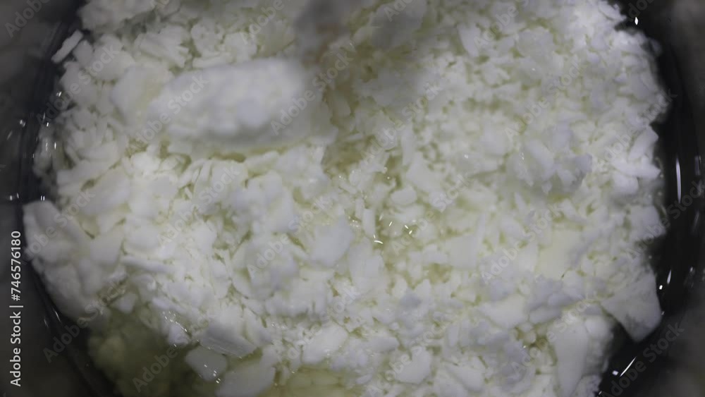 melting and mixing soybeans, making natural soy candles