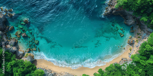Breathtaking aerial view of a secluded beach cove, with crystal-clear turquoise waters surrounded by lush greenery and rugged cliffs..