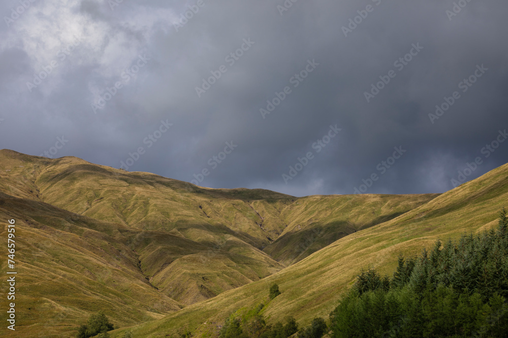 Aerial view of mountains with green grass and forest at Auch, Bridge of Orchy, Scottish Highlands Aerial view of mountains with green grass and forest at Auch, Bridge of Orchy, Scottish Highlands