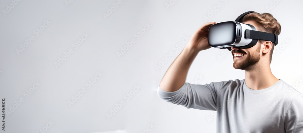 Banner with young smiling European man wearing virtual reality glasses. Vr headset. Banner with young smiling European man wearing virtual reality glasses. Vr headset.