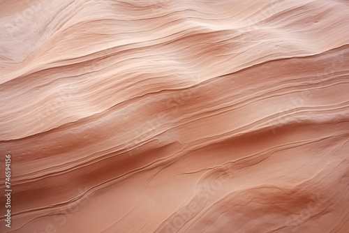 An abstract closeup of sandstone rock formations texture, sable, brown, pink and beige wavy lines background
