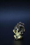 Ancient brass Ganesha or Ganapathi sculpture. Who's one of the most widely worshiped and also respected in Artistic science and various arts. It was profile shot in dark background.