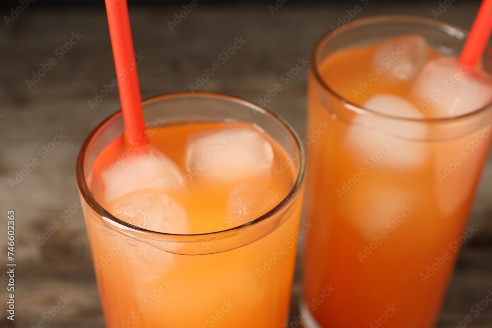 Tasty freshly made grapefruit juice on table, closeup Tasty freshly made grapefruit juice on table, closeup