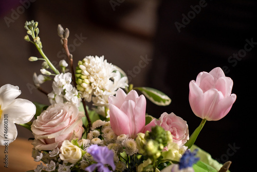 a beautiful delicate spring bouquet of tulips  buttercups and muscari  floral arrangement  