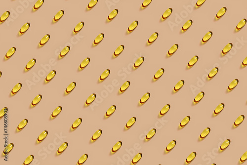 Omega-3 oil vitamin capsules in pattern on peach background