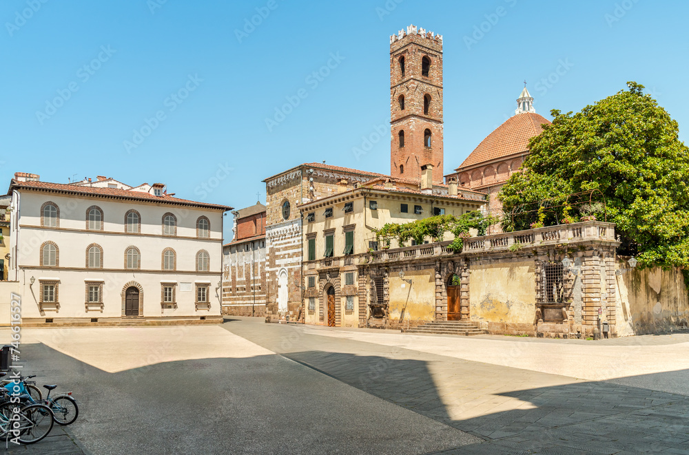San Martino square with view of the bell tower of the Church of Saints Giovanni end Reparata, in the oldest part of the historic center of Lucca, Tuscany, Italy