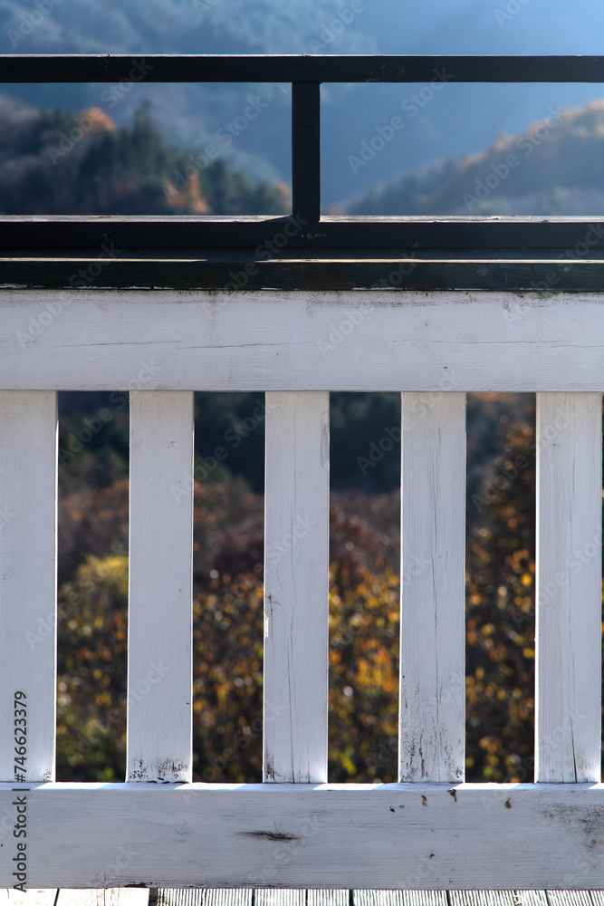 Fototapeta premium View of the wooden fence in the autumn mountain