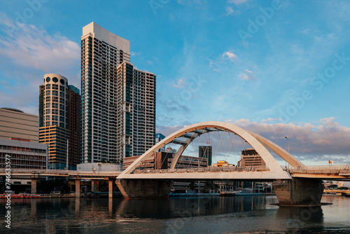 Manila City skyline during sunset with a bridge connecting Intramuros to Binondo