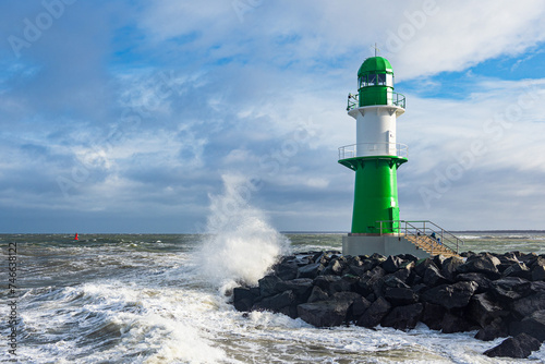 Die Mole an der Ostseeküste in Warnemünde an einem stürmischen Tag photo