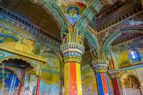 Thanjavur, Tamil Nadu, India - The high arches artworks and colorfully painted wall murals and ceilings of the ancient 17th-century durbar hall Maratha Palace in the town of Thanjavur. photo