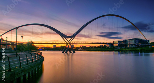 Infinity Bridge on dramatic sky at sunset in Stockton-on-Tees, UK.