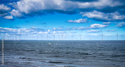 Offshore Wind Turbine in a Windfarm under construction off the England Coast at daytime
