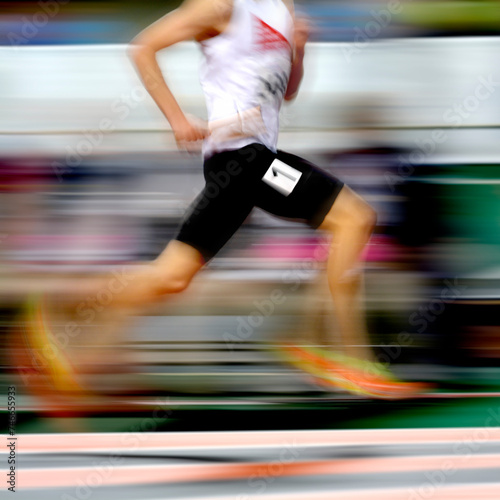 Runner Running a Race on Track with Baton Relay Team Score Motion Blur