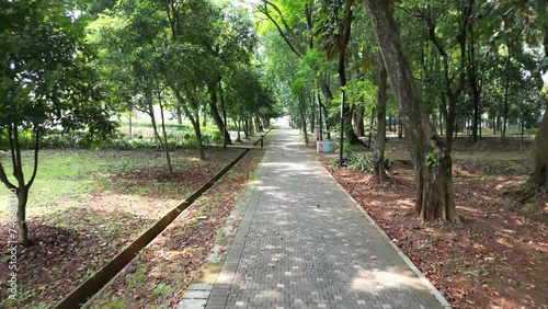 Explore Jakarta's Gelora Bung Karno park from the sky with drone footage. See iconic landmarks, bustling streets, and serene morning activities. Perfect place to start your day! photo