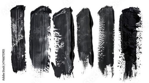 Abstract black paint smudges on a clean white surface, suitable for artistic projects photo