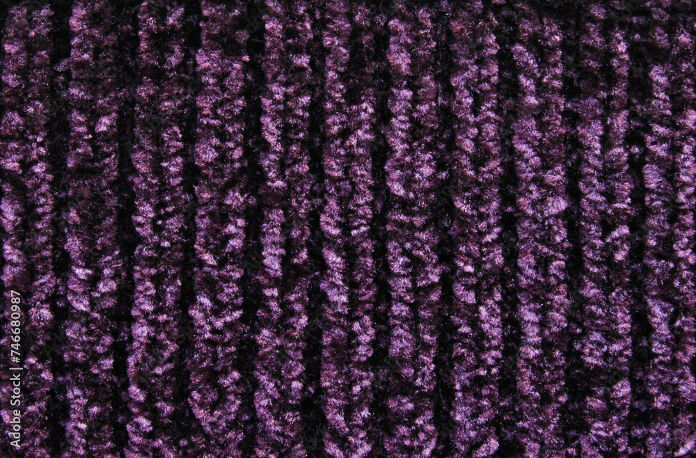 Purple fluffy velvet chunky knit fabric pattern as background
