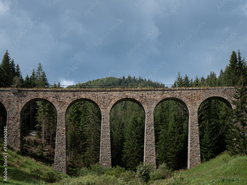 Naklejka premium Near the village of Telgárt, under Kráľová hoľa, in the picturesque surroundings of Horehronia, there is a remarkable technical structure - Chmarošský Viaduct.