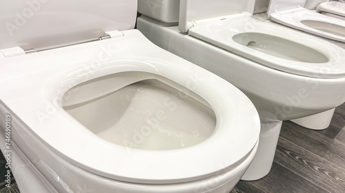 Close-up toilet bowl in plumbing store, Selective Focus, New Sanitary Ware for Washroom.