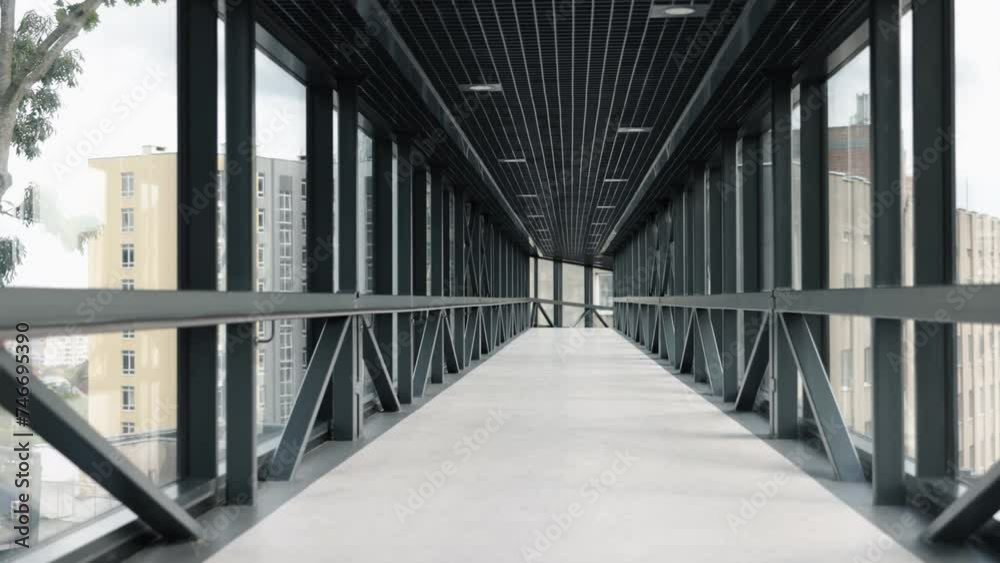 glass bridge, urban connector, metal structure. Contemporary, glass-encased aerial bridge with metal reinforcements, connecting pair buildings, vacant, amid lockdown. glass bridge, urban connector, metal structure. Contemporary, glass-encased aerial bridge with metal reinforcements, connecting pair buildings, vacant, amid lockdown.