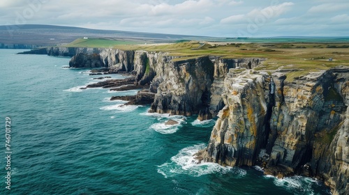  erial view of sea waves and a fantastic rocky coast  capturing the stunning beauty of the ocean meeting the rocky shoreline.