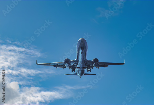 A plane in air near a airport. air travel with a modern plane