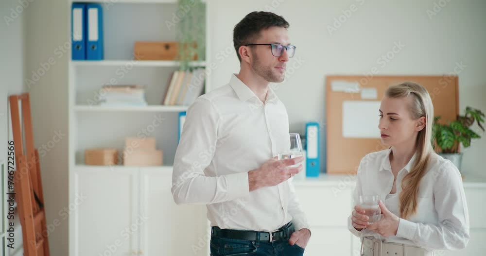 Young female and male colleagues planning strategy Young female and male colleagues planning strategy