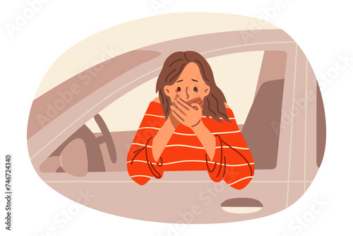Woman driver suffers from nausea driving, leans out of car and covers mouth with hand. Girl driver who was poisoned during lunch feels dizzy and has symptoms foreshadowing vomiting.