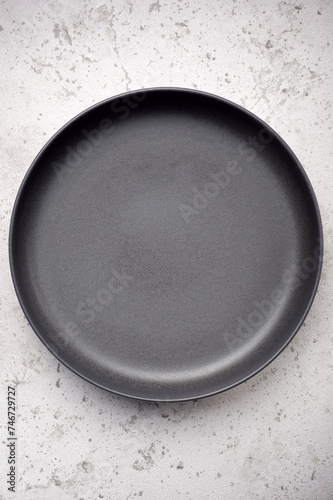 Empty porcelain dish on a kitchen table © WINDCOLORS