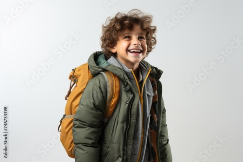  schoolboy with a backpack walking, in a warm jacket. autumn .  School, Travel, 