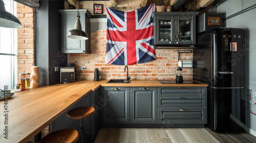 loft-style kitchen interior with British flag, black refrigerator and brick wall photo