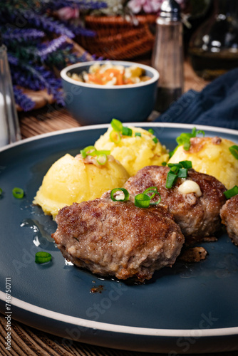 Meatballs with cheese served with boiled potatoes.