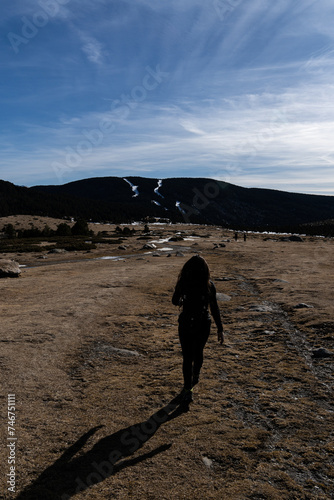 woman walking up the mountain