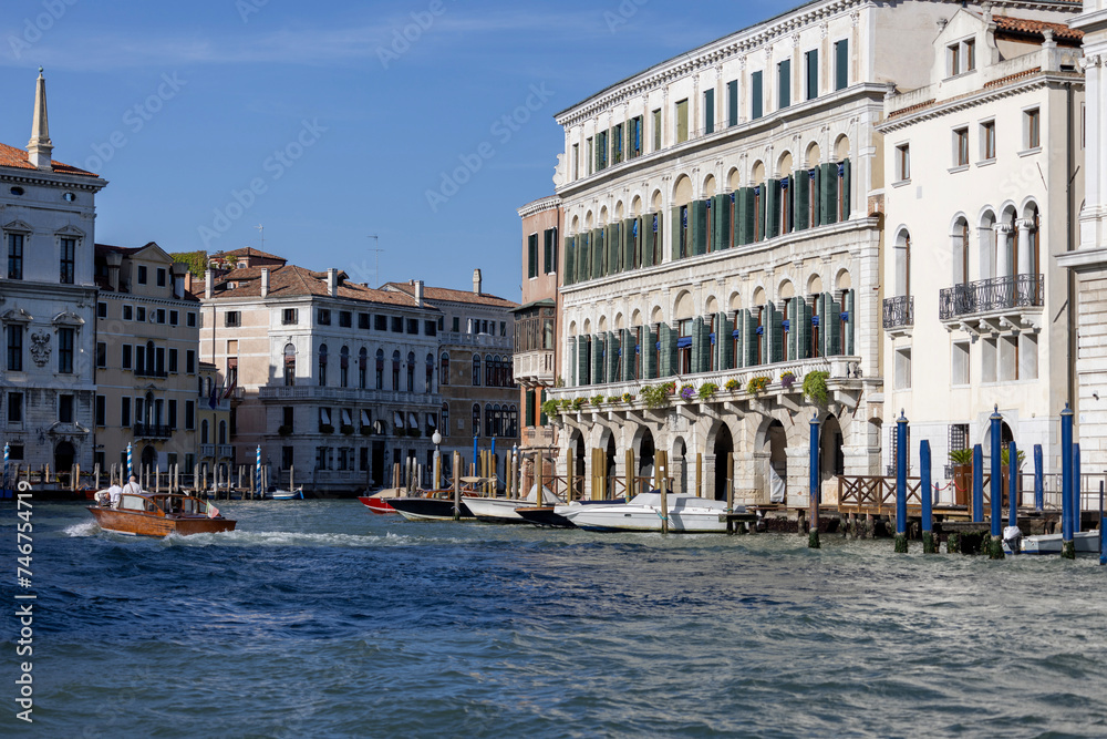 Grand Canal, historic decorative tenement houses, floating boats, Venice, Italy