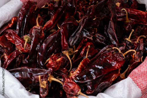 Dried red chili peppers in a sack at Levinski Market, Tel Aviv, vibrant and spicy photo