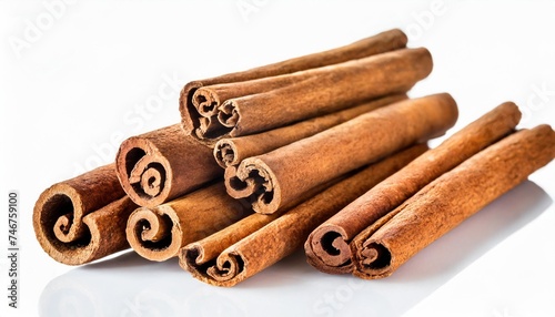 collection of cinnamon sticks isolated on white background photo