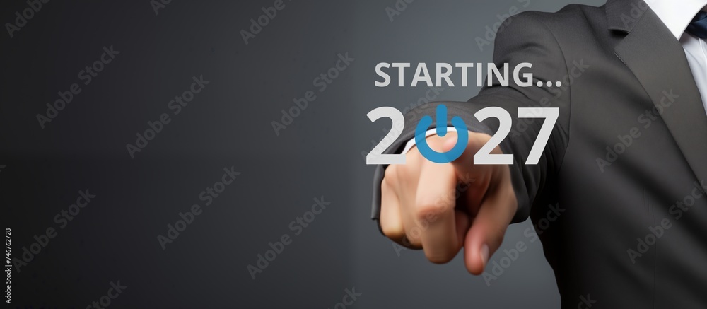Businessman on blurred background using new year concept on virtual screen Businessman on blurred background using new year concept on virtual screen