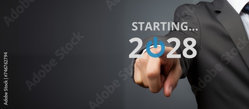 Businessman on blurred background using new year concept on virtual screen